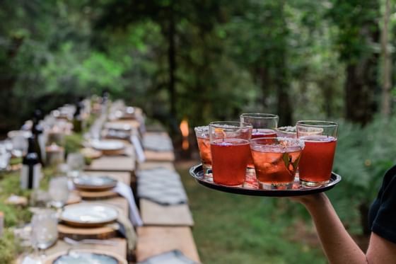 Set table and a waiter with drinks at Alderbrook Resort & Spa