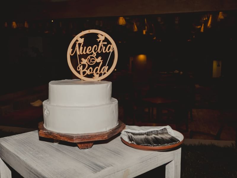 Wedding cake with topper at Fiesta Americana Riviera Nayarit Resort & Spa.