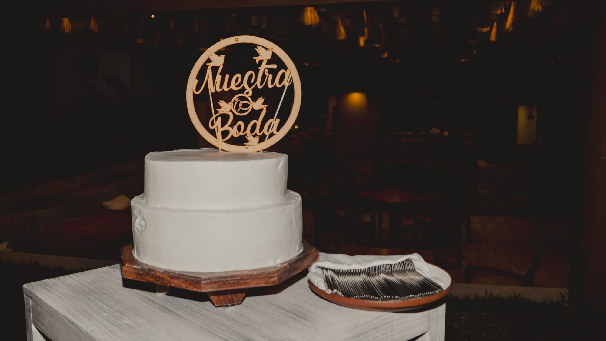 Wedding cake with topper at Fiesta Americana Riviera Nayarit Resort & Spa.