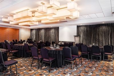 Banquet table set up in an Amber ballroom at Matrix Hotel