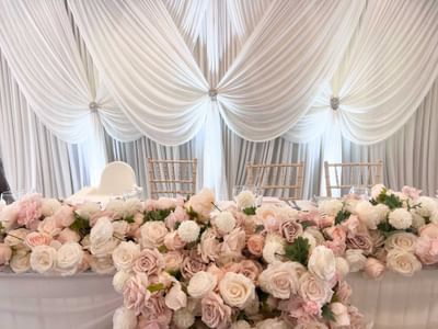 Roses arranged in a dining table at Orsett Hall Hotel