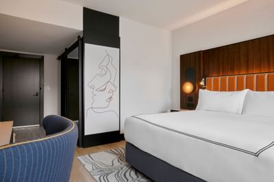 Cozy bedroom with modern interior & decor in 1 King Bed at Godfrey Hotel Detroit