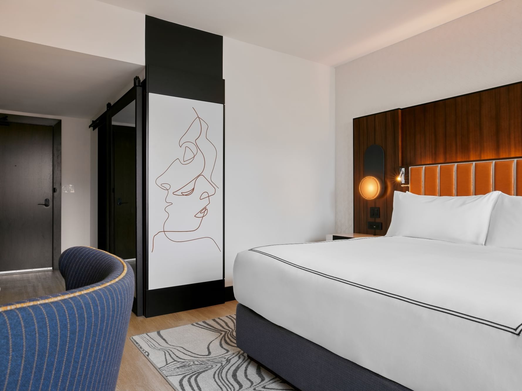 Cozy bedroom with modern interior & decor in 1 King Bed at Godfrey Hotel Detroit