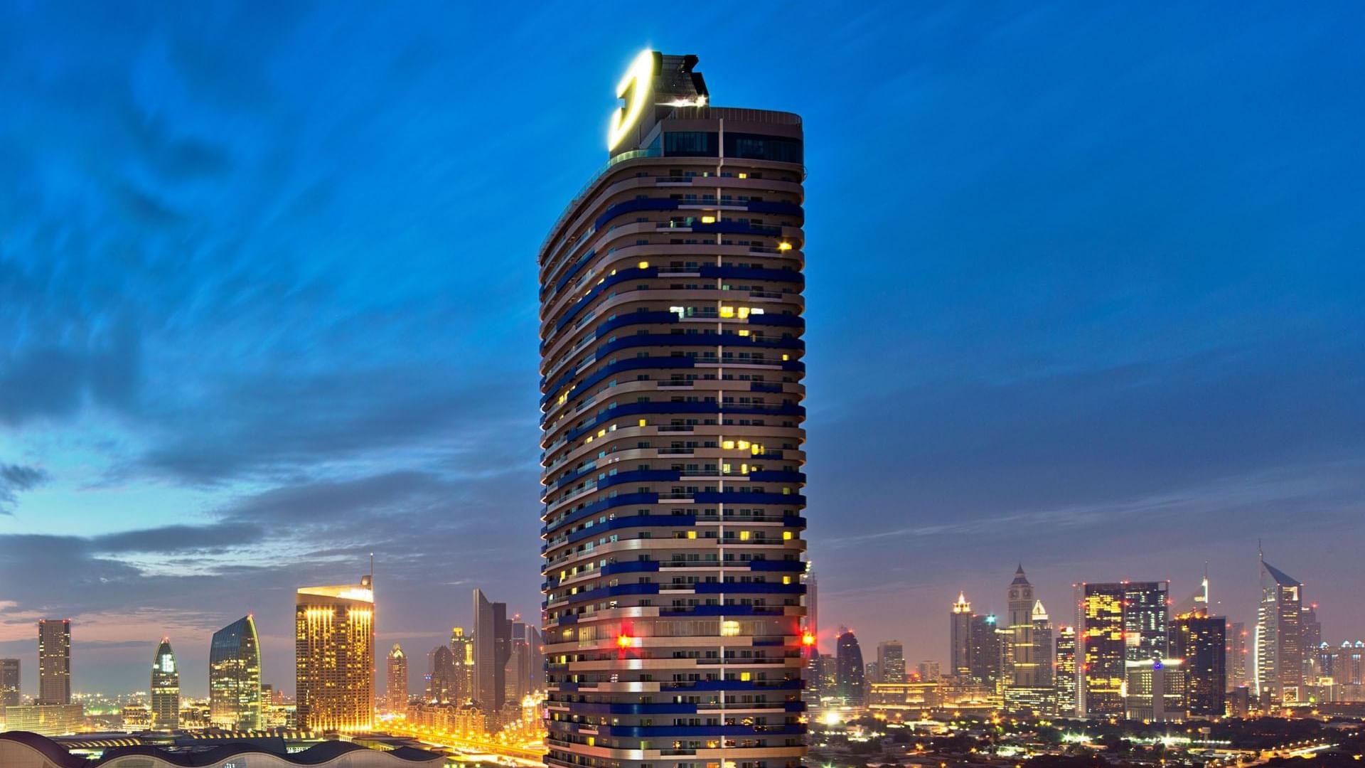 Exterior view of the DAMAC Maison Dubai Mall Street with city