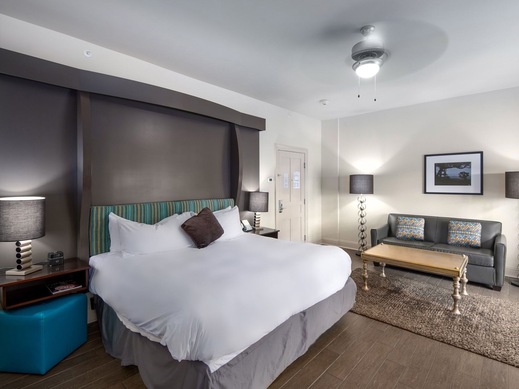 Suite King Bed Gulf View with a king bed, sofa, coffee table, and dark wood accents at The White House Hotel