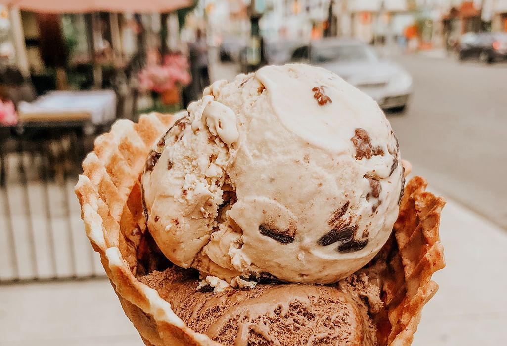 big cone of ice cream with nuts and chocolate