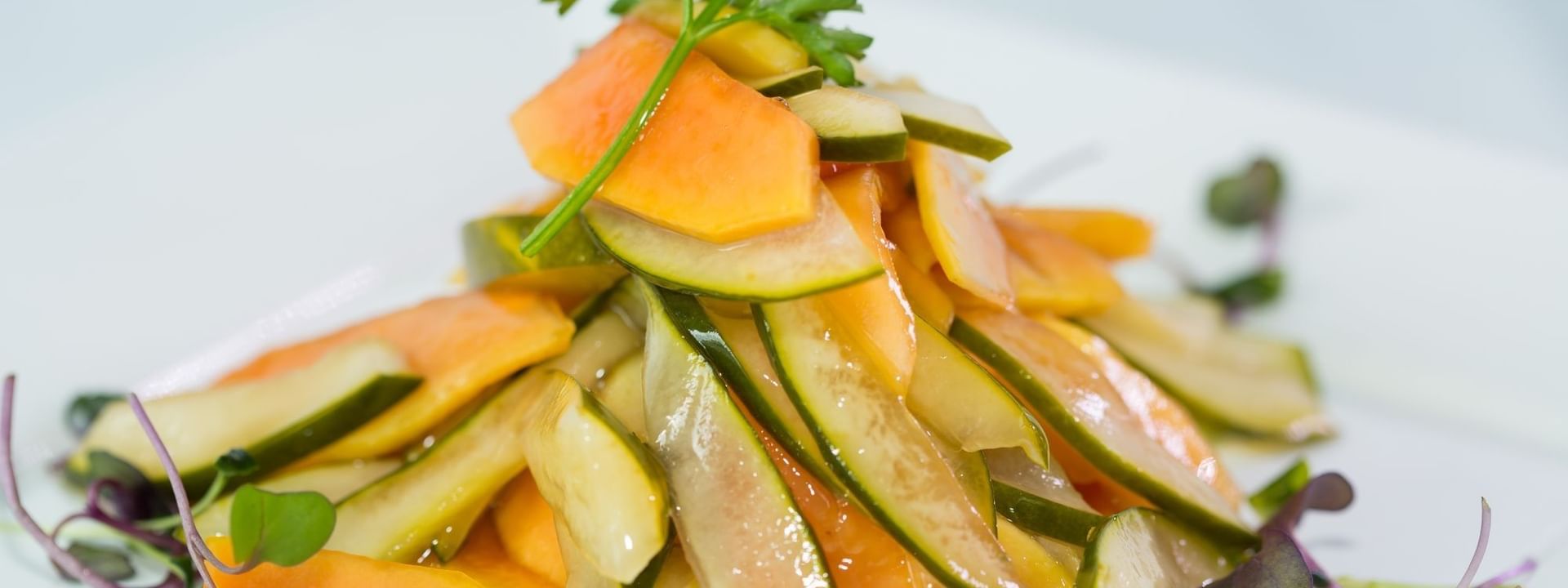 Slices of melon and cucumber surrounding a parsley garnish in Tings on a Stick at Warwick Paradise Island Bahamas