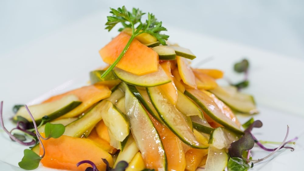 Slices of melon and cucumber surrounding a parsley garnish in Tings on a Stick at Warwick Paradise Island Bahamas