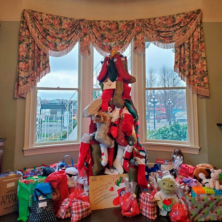Festive Christmas tree with stockings and toys at Pendray Inn & Tea House