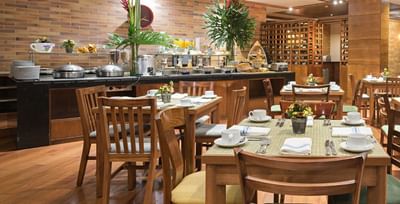 A bright Zoe Restaurant at Habitel Hotel Select with a delicious breakfast buffet and tables set for guests