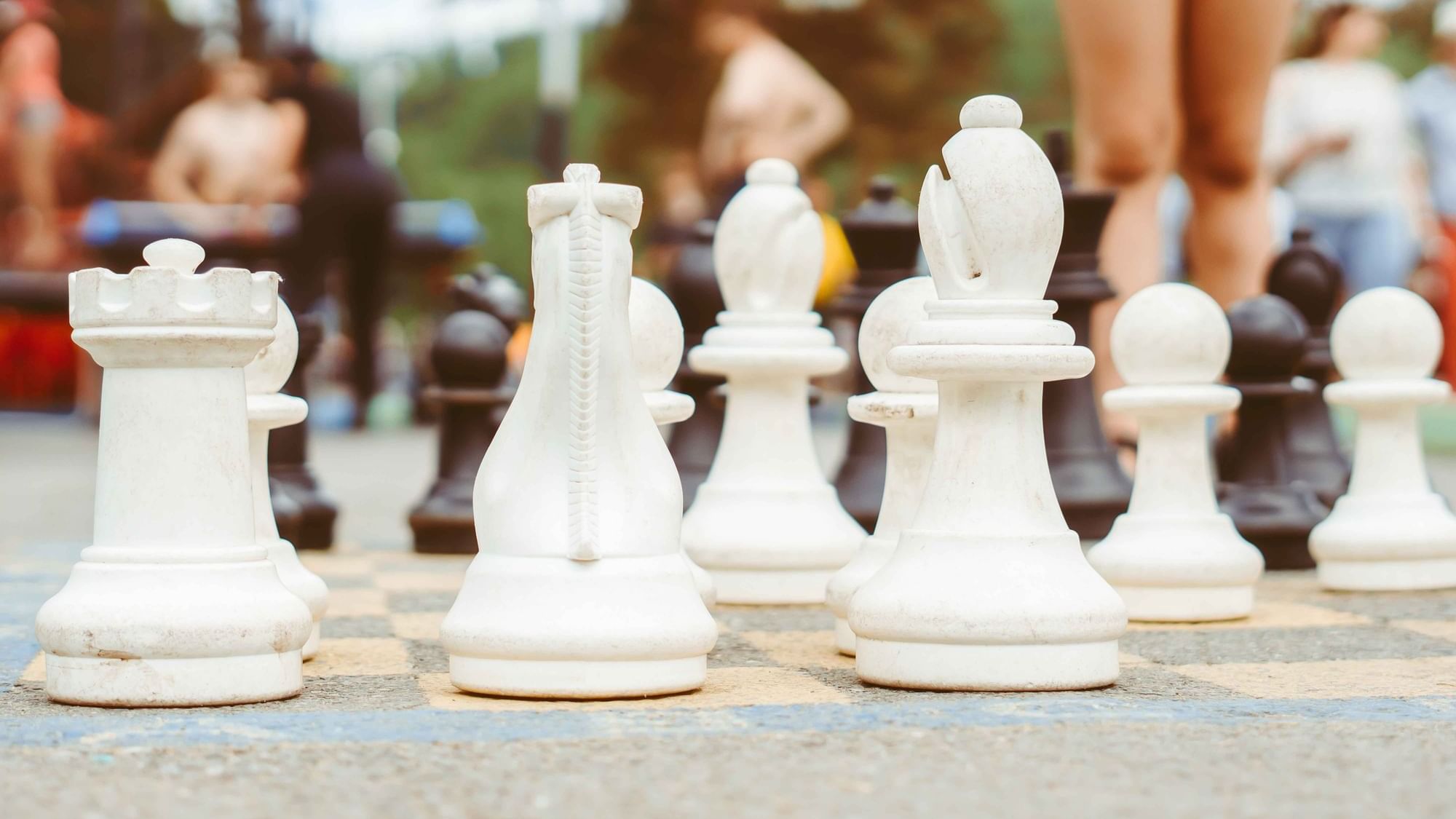 Close-up on chess pieces of the Giant Checkers board outdoors at Cove Pocono Resorts