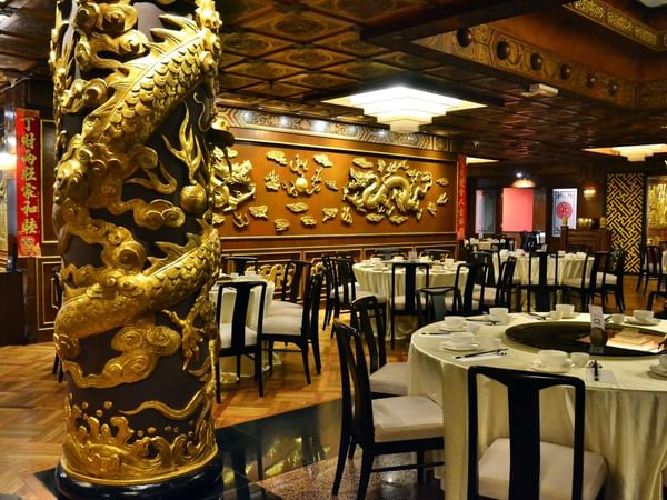 Gold dragon decor on the Restaurant walls at Federal Hotels International