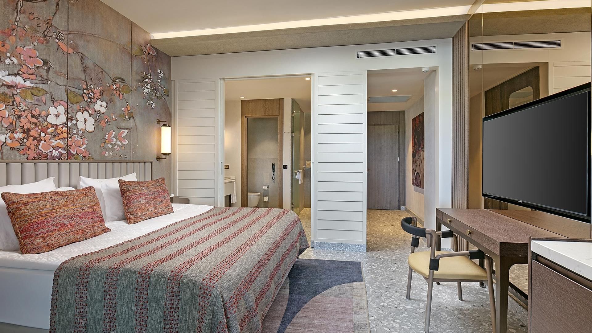 TV & work desk facing the bed in Roof Superior Room at Cullinan Belek