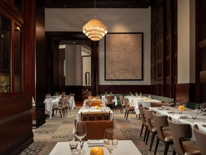 Refined steakhouse interior with warm lighting and intimate seating.
