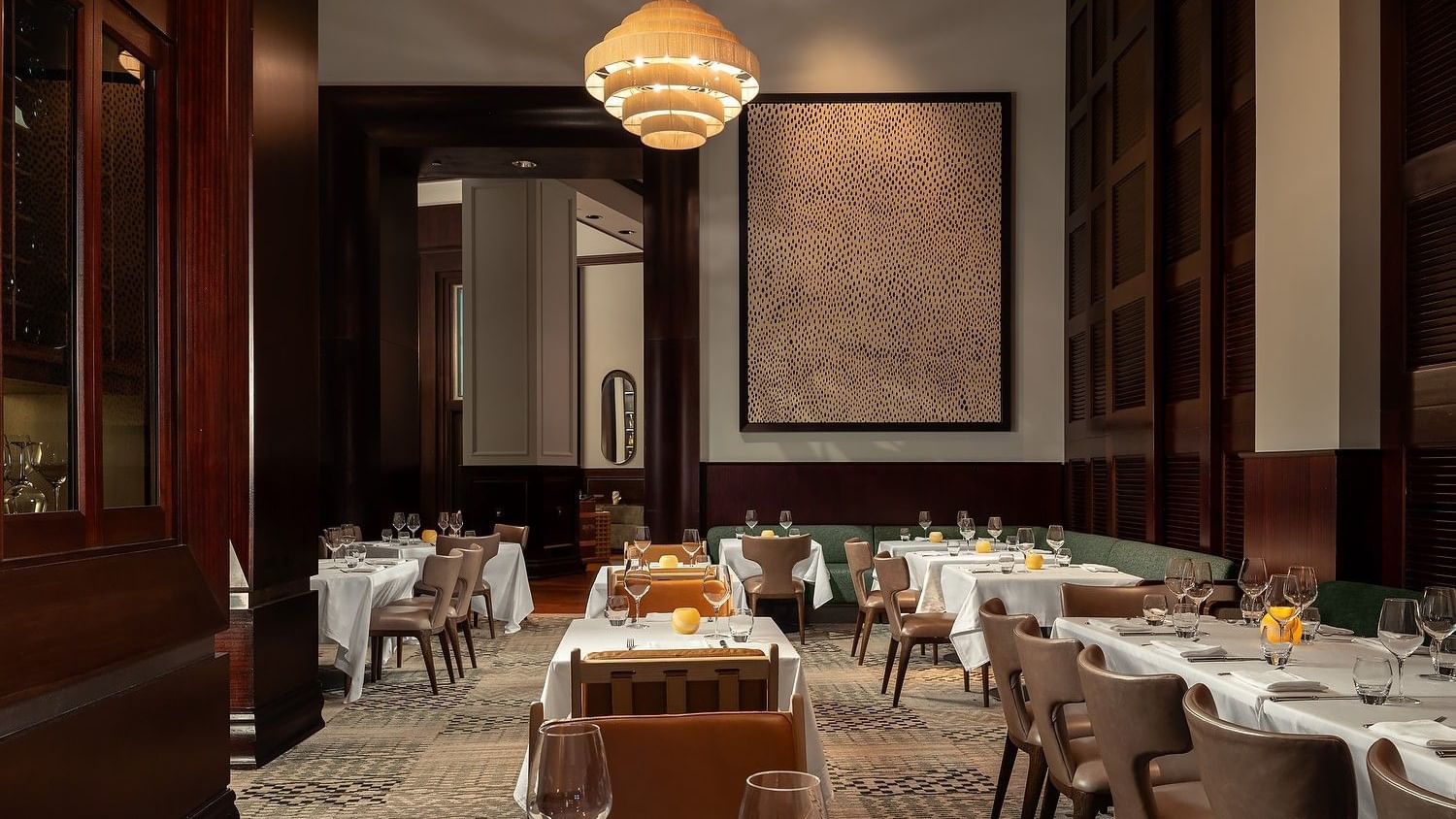 Refined steakhouse interior with warm lighting and intimate seating.