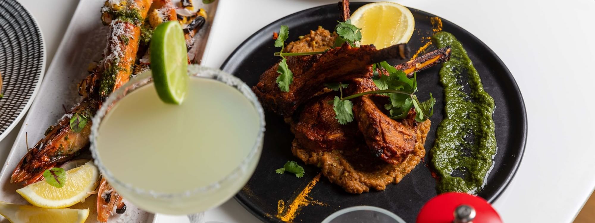 Close-up of delicious in-room dining, including ribs and a margarita at Novotel Sydney on Darling Harbour