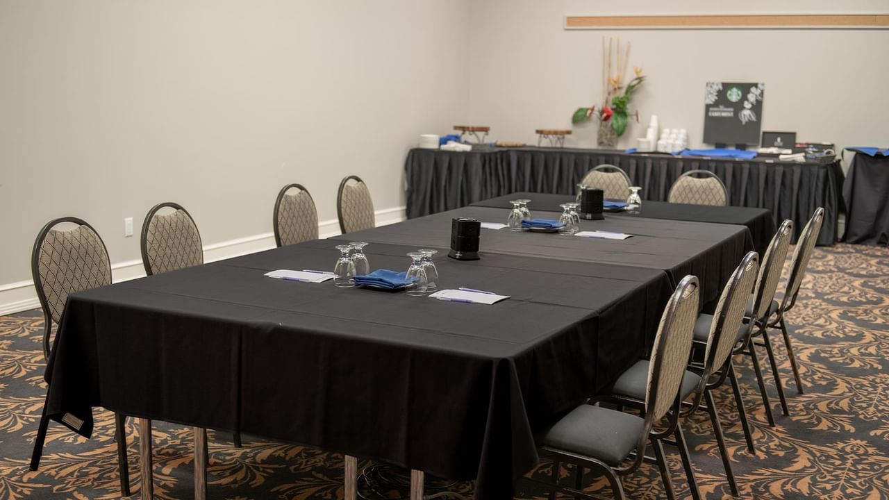 Meeting room setup with table and chairs.