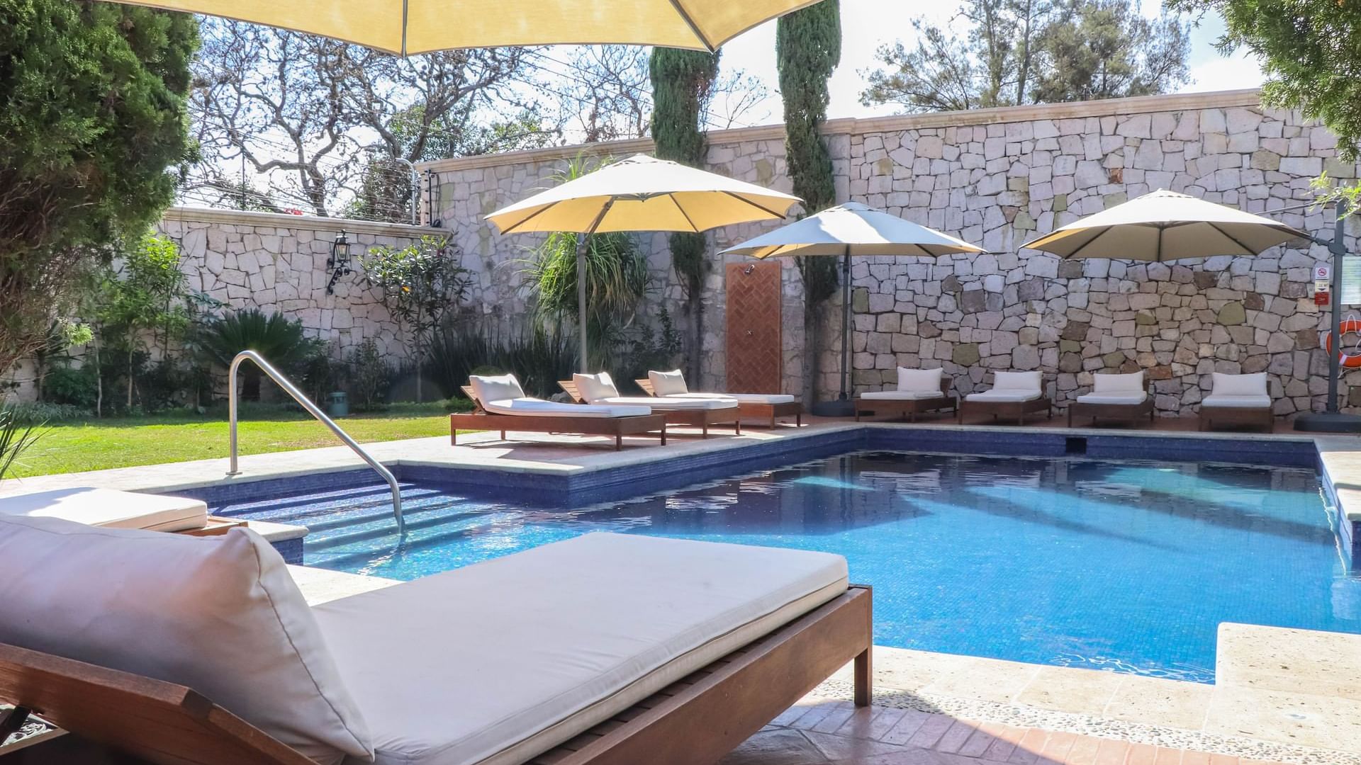 Sunbeds by the Swimming Pool at Gamma Morelia Vista Bella