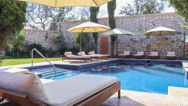 Sunbeds by the Swimming Pool at Gamma Morelia Vista Bella