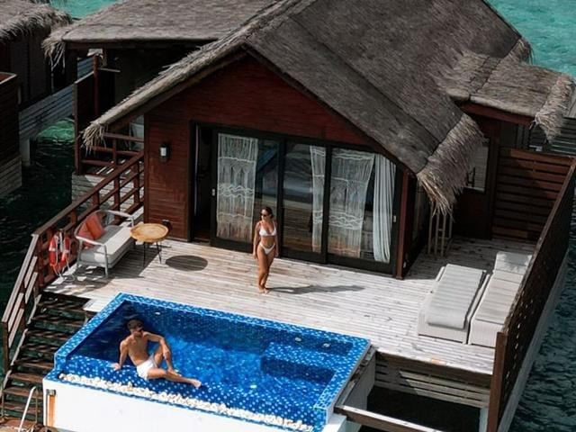 Couples enjoying a private pool villa retreat