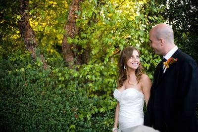Bride and groom smiling at each other