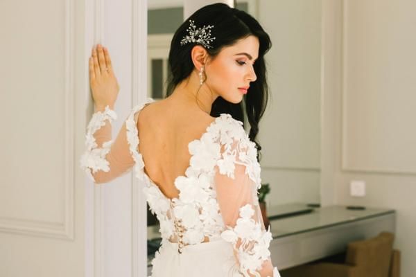 Bride in her wedding dress posing before the ceremony