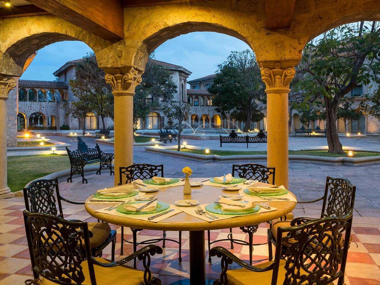Tierra Mía outdoor dining area with arched colonnade overlooking courtyard at Quinta Real Aguascalientes, Aguascalientes