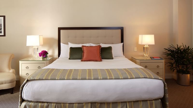 Cozy bed with side tables in Suites with Terrace at Warwick New York