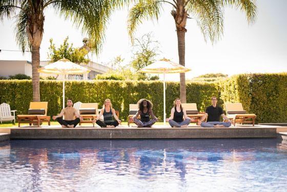 Pool side Yoga Event - The Magnolia Hotel 