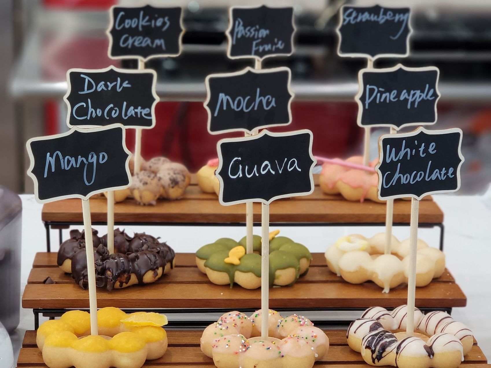 Mochi donuts with various toppings and flavors at Grand Legacy at The Park Anaheim.