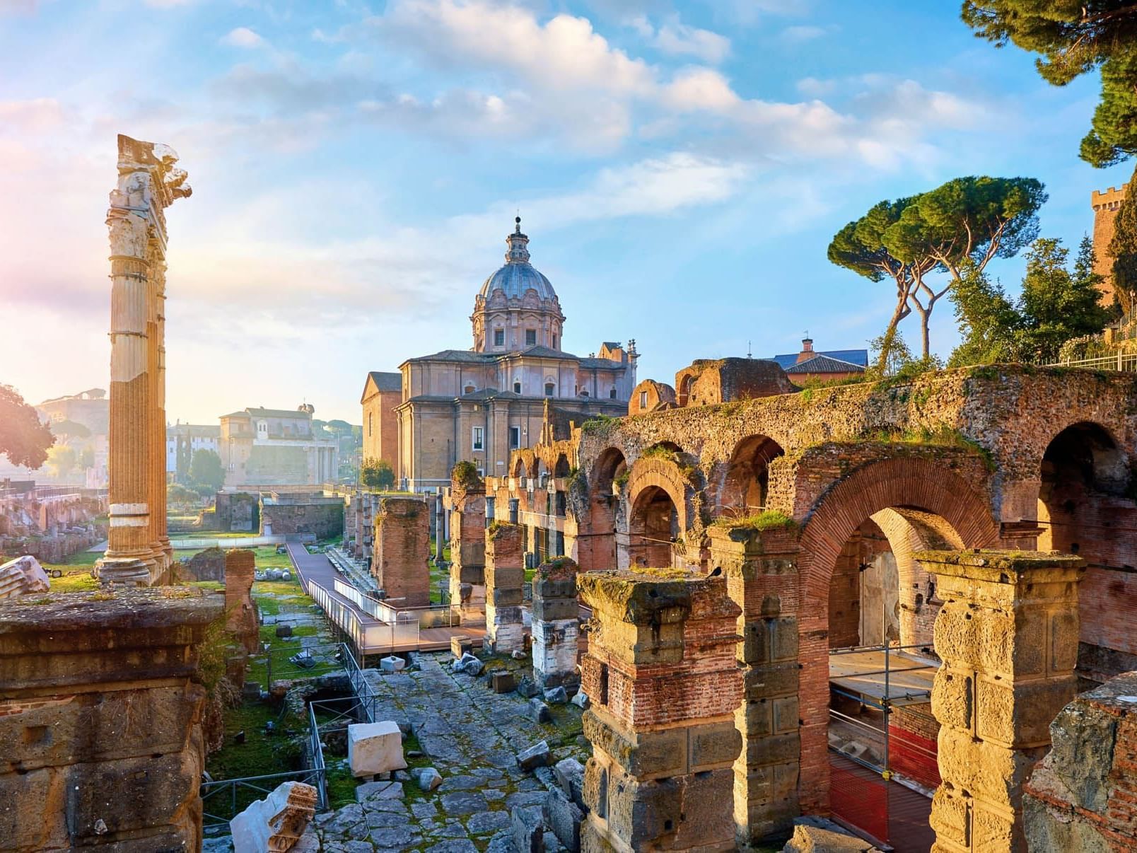 Distant view of Roman Forum with historic buildings near The Independent