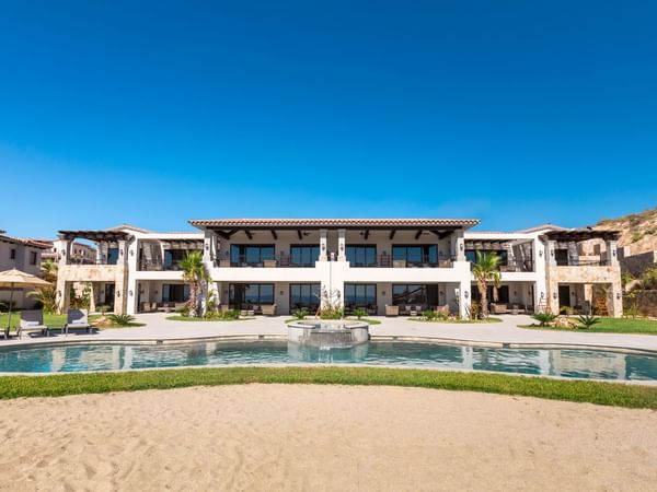 Exterior view of the hotel with a pond with water fountain