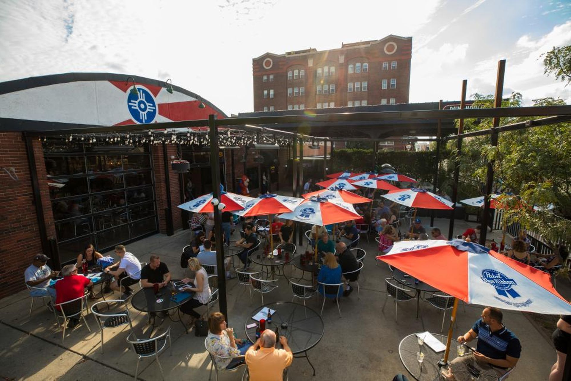 A patio area with outdoor seating and umbrellas.