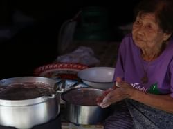 Old lady selling foods in Nong bua walking street  near Chatrium Golf Resort Soi Dao Chanthaburi 