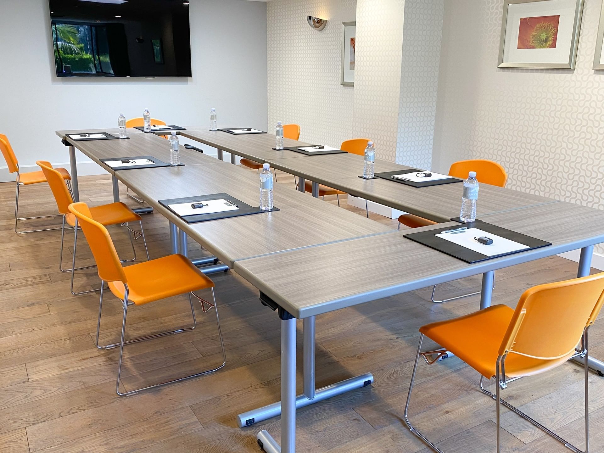 Tables and chairs setup for meeting at Luxe Sunset Boulevard