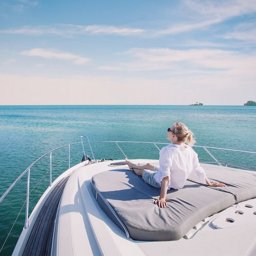 A lady relaxing on a Yacht near Falkensteiner Hotels