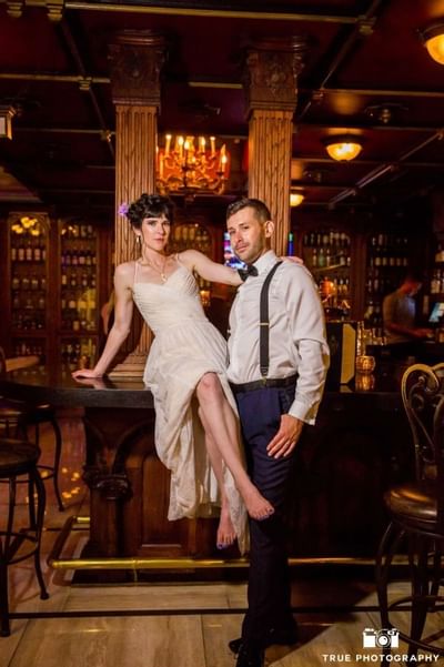 Portrait of the bride and groom in a bar at Horton Grand Hotel
