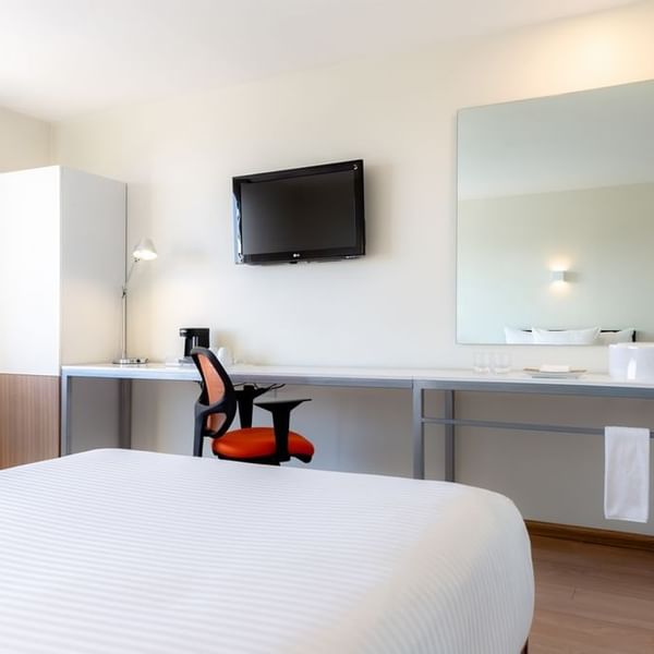 Interior of a room with twin beds at Gamma Hotels