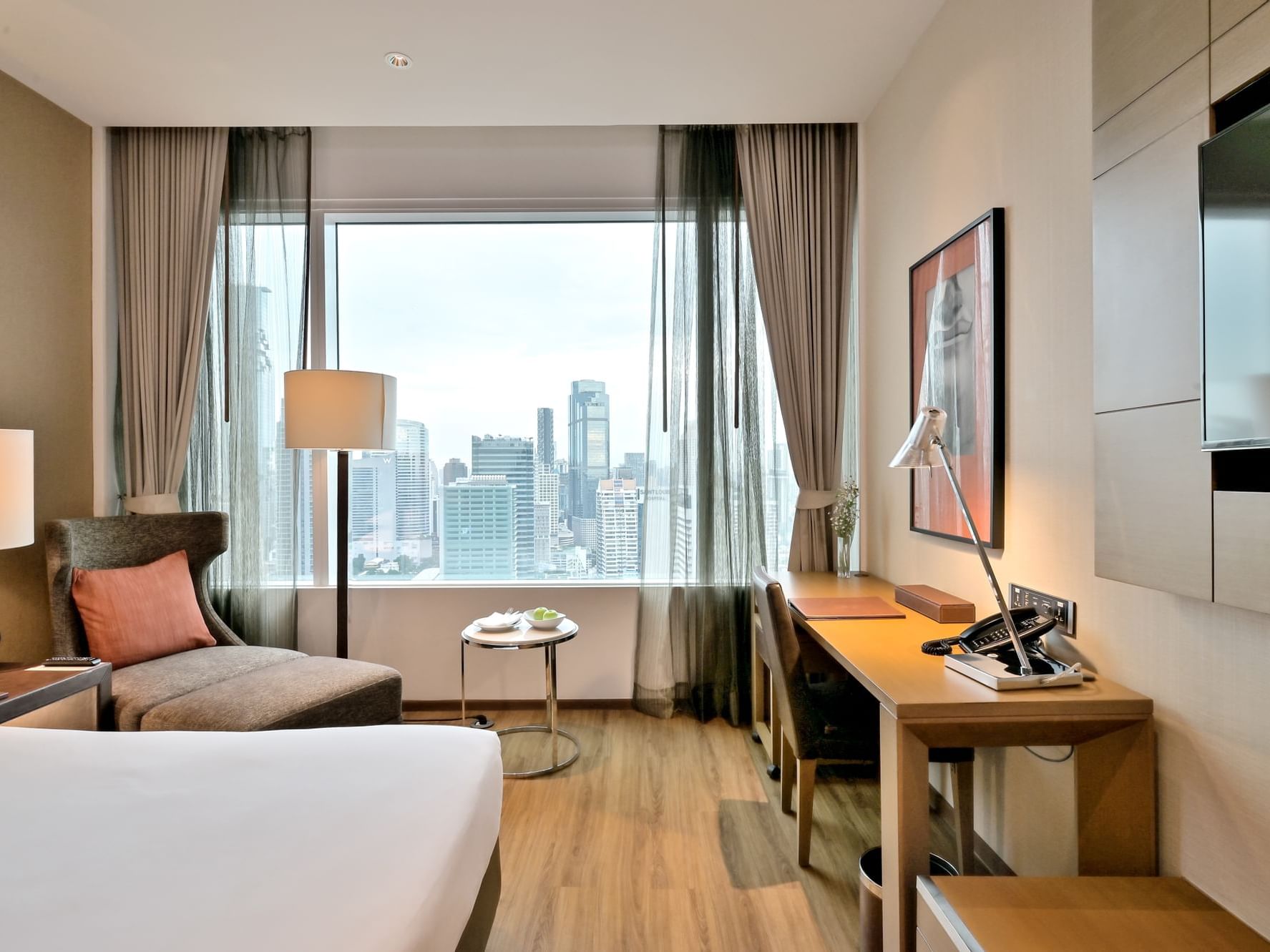 Working desk with TV in Executive Superior Sky with Lounge access at Eastin Grand Hotel Sathorn