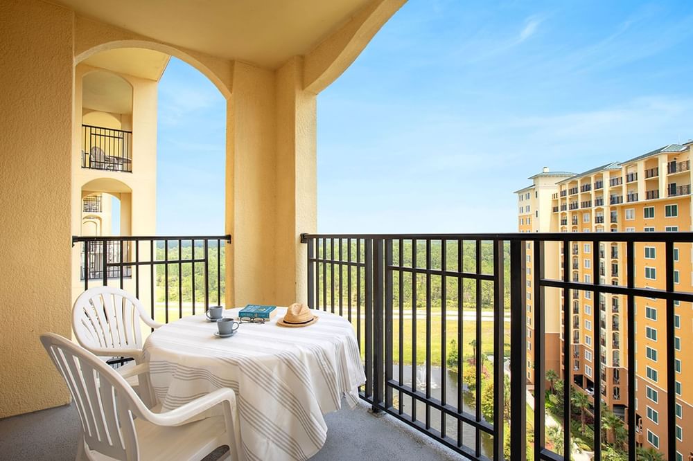 Balcony view with a table and seating in 1 Bedroom Suite at Lake Buena Vista Resort Village & Spa