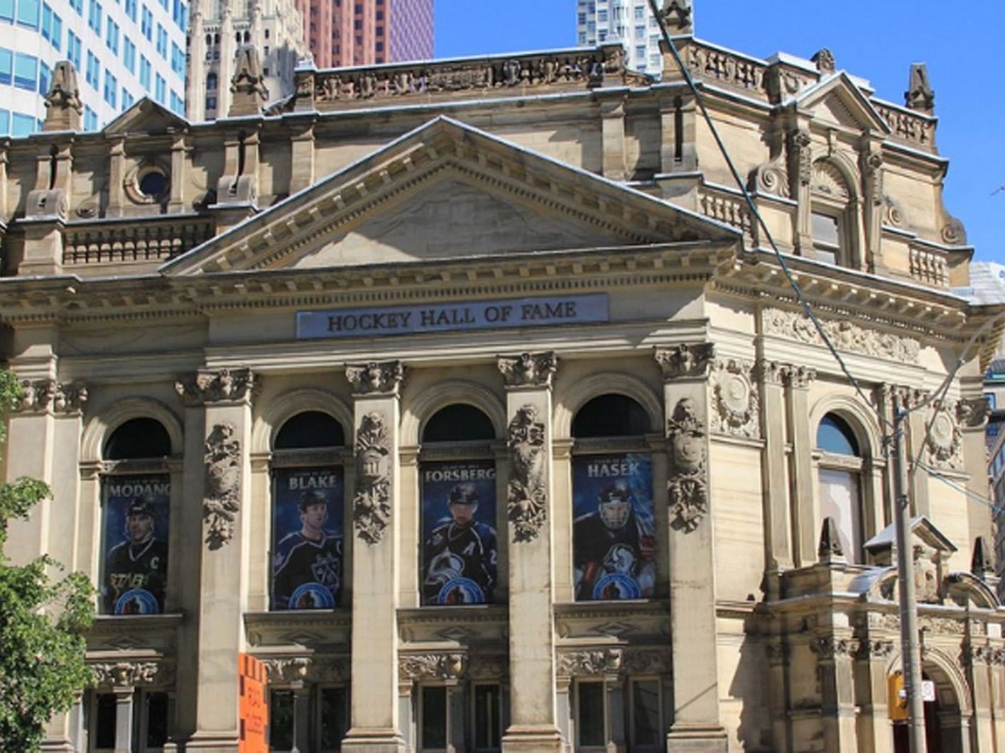 Facade of the Hockey Hall of Fame with player banners near Hotel X, downtown Toronto hotel