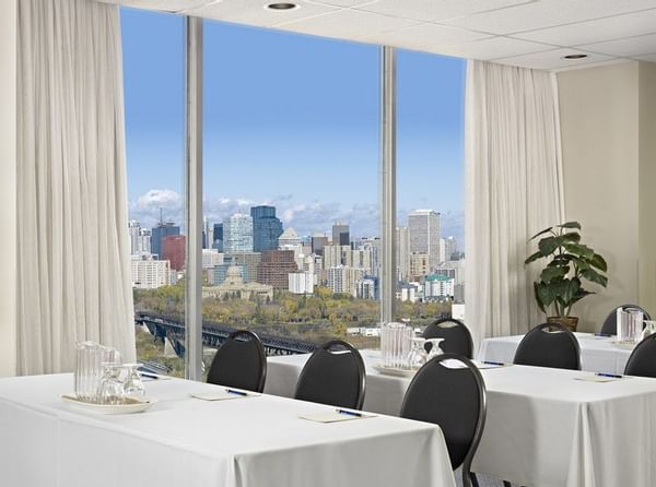 Table set up for event with view of downtown Edmonton