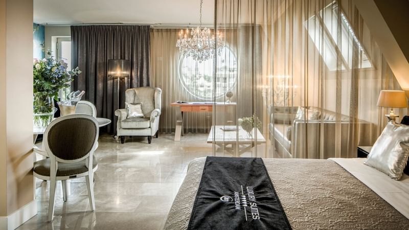 Bed and living area in Royal Penthouse at Luxury Suites Amsterdam