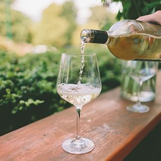 wine being poured on an outdoor patio