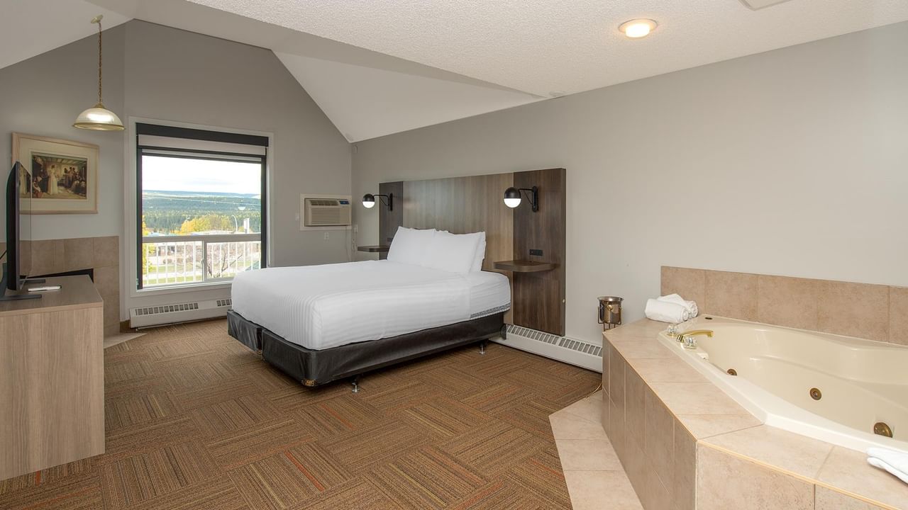 Coast Suite with king bed, jetted tub, and mountain views.