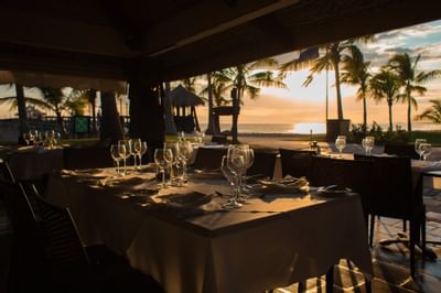 Dining area in a restaurant at Fiesta Resort at sunset
