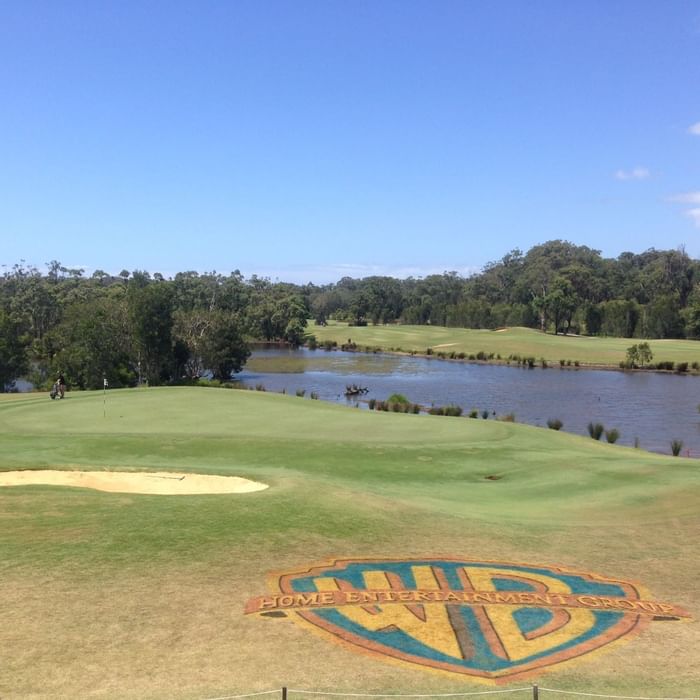 Warner Bros logo near lake at Mercure Kooindah Waters