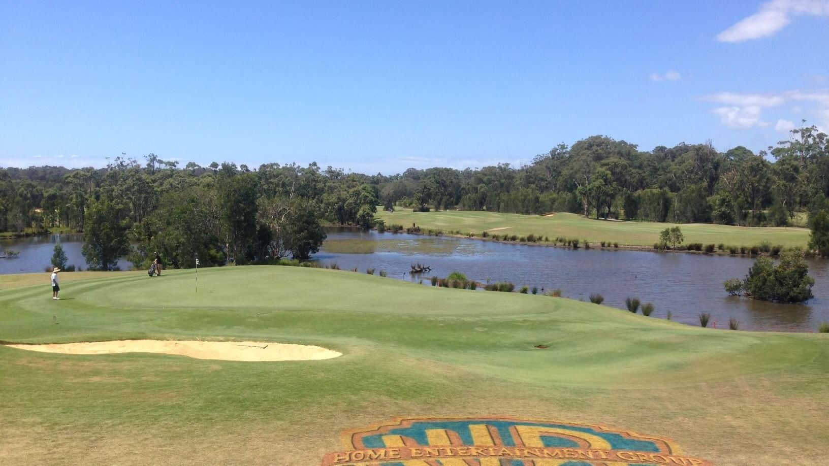 Warner Bros logo near lake at Mercure Kooindah Waters