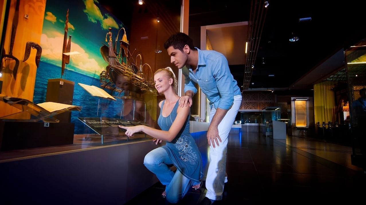 Couple studying exhibits at National Museum near Sunway Lagoon