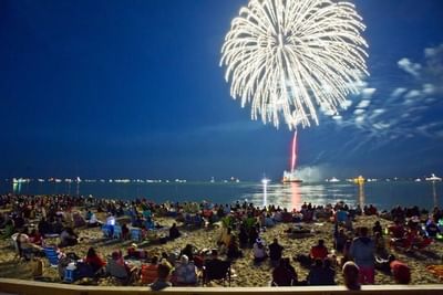 Crowds gathered to watch fireworks over the water